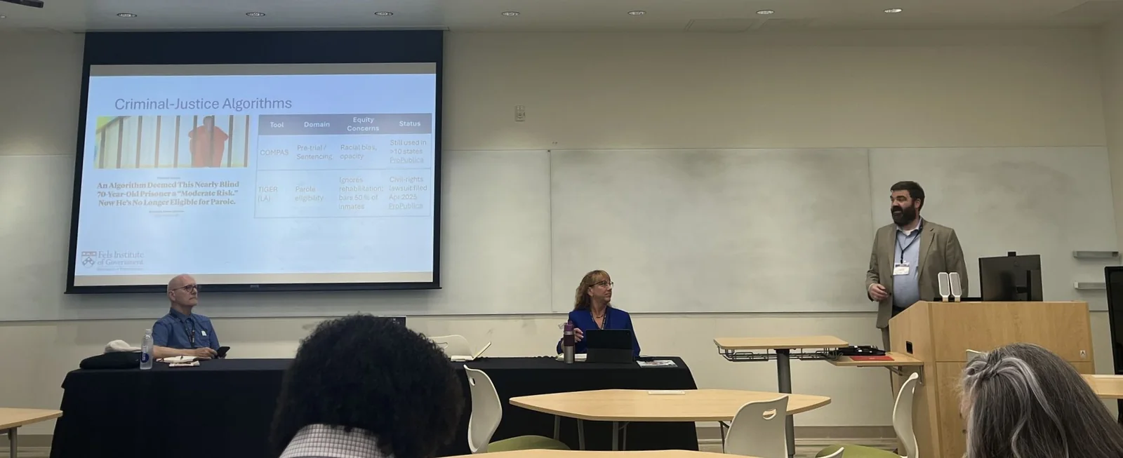 Dylan Hayden presenting to a group in a meeting room